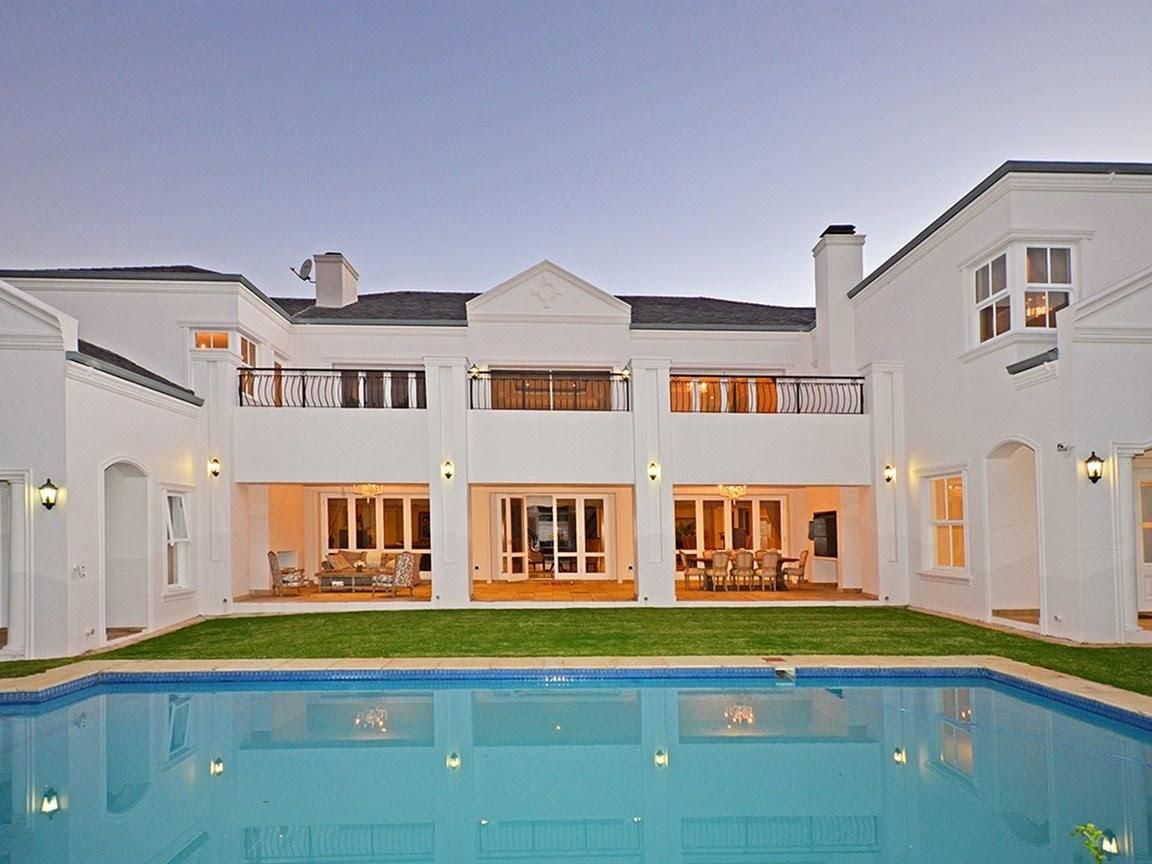 Classic white mansion exterior with pool